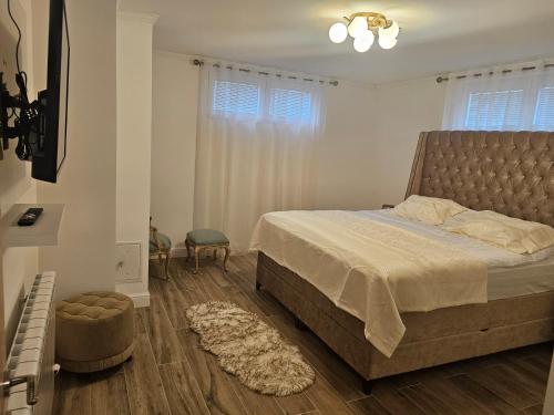 a bedroom with a large bed and a window at Montain House Rakocevic in Kolašin