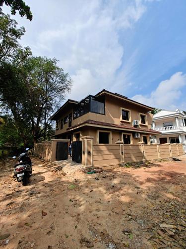 a house that is being built in the dirt at The Sharva 3 by Shiva stays with Open Air Bathtub, Close to Varca beach in Varca