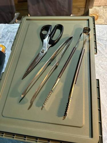 a tray with scissors and other items on a table at 트리하우스 in Suncheon