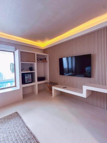 TV a/nebo společenská místnost v ubytování Xeno Hotel Boutique