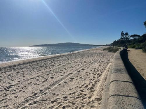 a view of the beach from the shoreline at Beach front unit in Capel Sound in Capel Sound