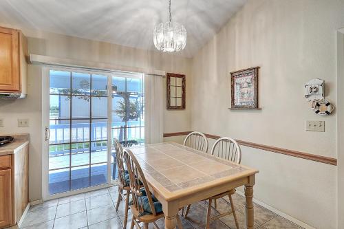 a kitchen and dining room with a table and chairs at Seashell Memories in Rockport