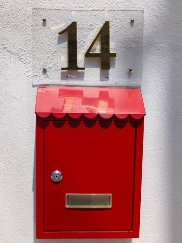 a red box with the number on it at Kings Pine Residence homestay 14 in Ranau