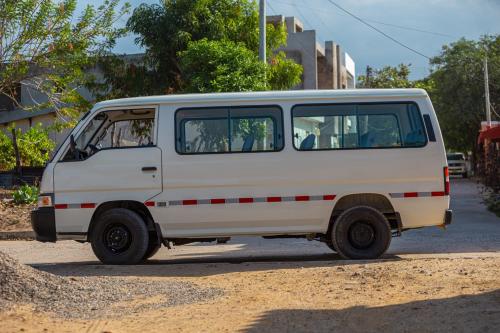 a white van parked on the side of a street at Palaa Mujuii Hotel in Dibulla