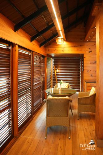 a dining room with a table and chairs at Maliekal Heritance Cherai Beach Cochin in Cherai Beach