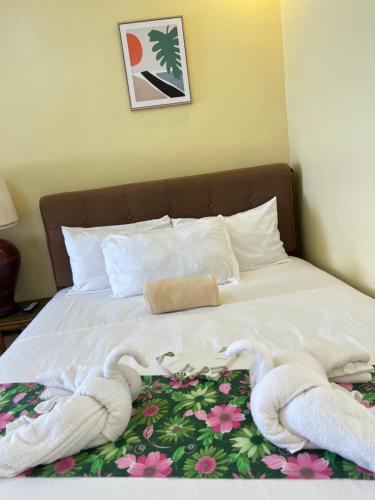 a bed with towels on top of it at C View Resort in Sipalay