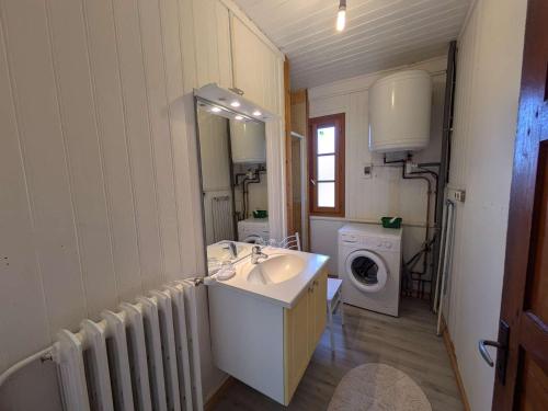 a bathroom with a sink and a washing machine at Appartement 2 chambres, 5 pers., cœur de village avec parking - FR-1-342-323 in Beaufort