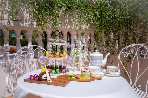 a table with a plate of food on top at La Sapinette Hotel Dalat in Da Lat