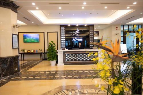 a lobby of a hotel with a bar at La Sapinette Hotel Dalat in Da Lat
