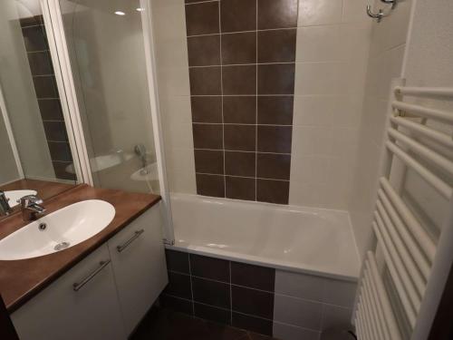 a bathroom with a sink and a shower and a tub at Appartement T2 Hauteluce, 4 pers., piscine, parking, WiFi - FR-1-342-322 in Hauteluce