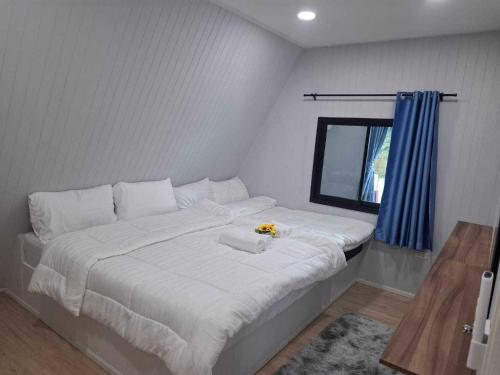 Ένα ή περισσότερα κρεβάτια σε δωμάτιο στο Nakorn resort & cafe