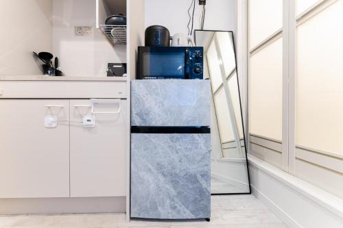 Η κουζίνα ή μικρή κουζίνα στο 高田馬場アネックス Condo