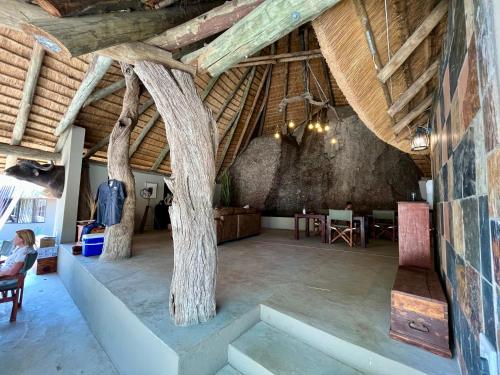 a large room with trees in the ceiling at Timbila Game Lodge - Welcome to Land of Leopards and Buffalo in Phalaborwa