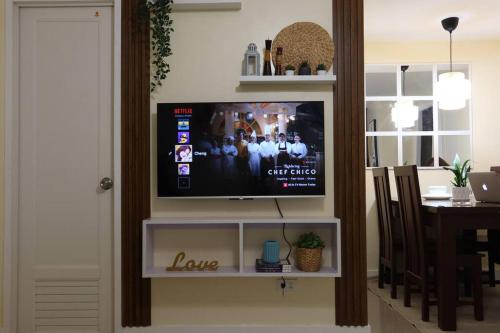 a flat screen tv sitting on a white entertainment center at Skyline Home Antipolo in Antipolo