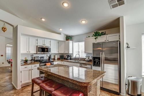a kitchen with white cabinets and a granite counter top at Route 66 Oasis in Downtown Gilbert with Heated Pool & Mini Golf in Gilbert