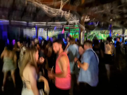 a group of people dancing at a party at David Hostel in Koh Rong