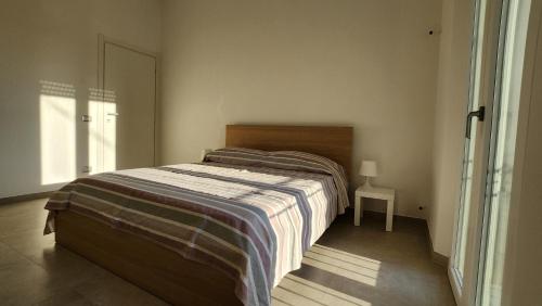 Postel nebo postele na pokoji v ubytování Aurora Rooms - Affitti Brevi Italia