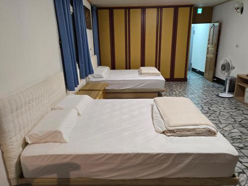 Postel nebo postele na pokoji v ubytování 高鐵中彰309民宿