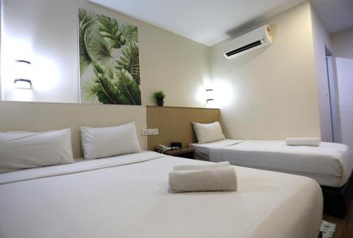 Кровать или кровати в номере ECO Hotel at BBCC