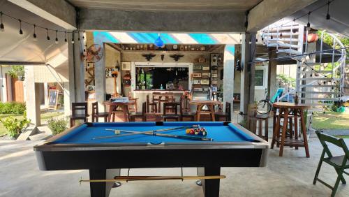 a pool table in the middle of a patio at Seven 50s in Pai