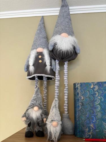 a group of three gnomes sitting on a shelf at Haus Nina near Willingen and Winterberg in Olsberg