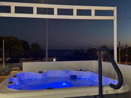 a blue bath tub in a room with a view at Casa Mazagón con vistas al mar in Mazagón