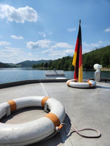 a couple ofotation devices on a boat on a lake at Haus Nina near Willingen and Winterberg in Olsberg