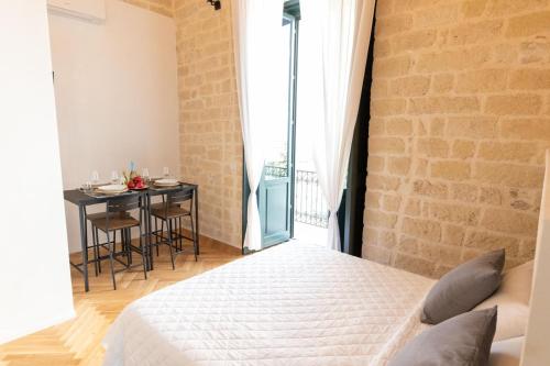 Postel nebo postele na pokoji v ubytování Centro Storico Rooms & Suites