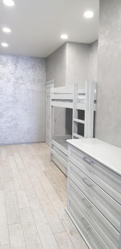 a room with a bunk bed in a room at Грибовка Апартаменты 134 - 137 Black Sea Bugaz in Gribovka