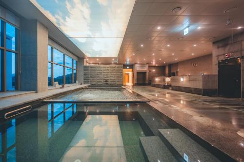 an indoor swimming pool in a building at Wonju city hotel in Wonju