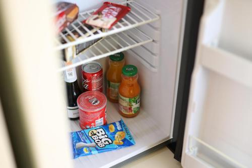an open refrigerator filled with food and drinks at СПА-Готель "RESPECT" in Skhidnitsa