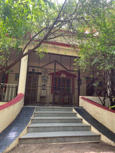 a set of stairs leading to a building at Sharad Baug homestay in Bhuj