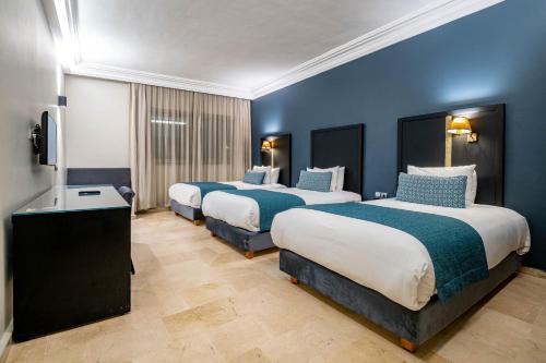 Ένα ή περισσότερα κρεβάτια σε δωμάτιο στο Diwan Casablanca Hotel & Spa