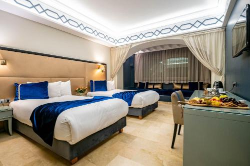 Ένα ή περισσότερα κρεβάτια σε δωμάτιο στο Diwan Casablanca Hotel & Spa