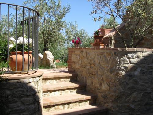 a set of stone stairs with a metal gate at Agriturismo Borghetto Il Montino in Rapolano Terme