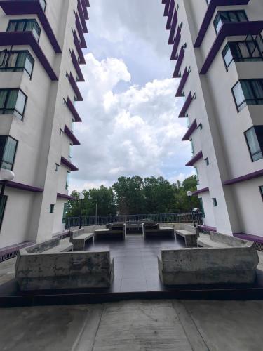 an empty courtyard between two tall buildings at Ayer Keroh D153A 6-8 pax Comfort Stay - GXHomes in Melaka