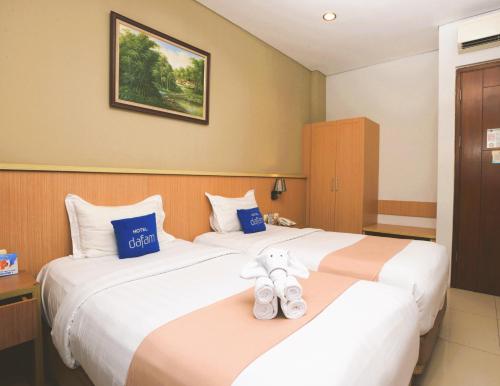 Postel nebo postele na pokoji v ubytování Hotel Dafam Rio