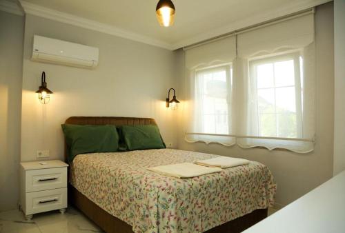 Postel nebo postele na pokoji v ubytování Villa derin