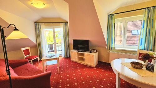 Hotel Godewindにあるテレビまたはエンターテインメントセンター