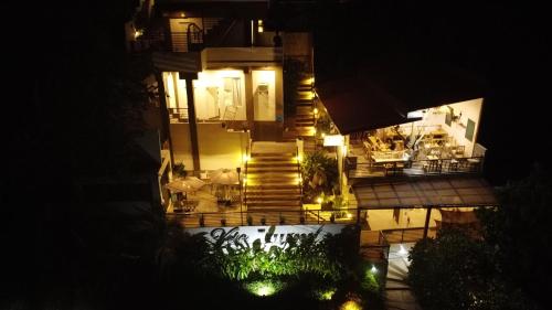 an aerial view of a building at night at Vela Terraces Hotel in Coron