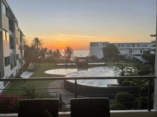 a view from a balcony of a resort with a pool at Karon Beach Large 2 bedrooms & living room Seaview apartment in Karon Beach