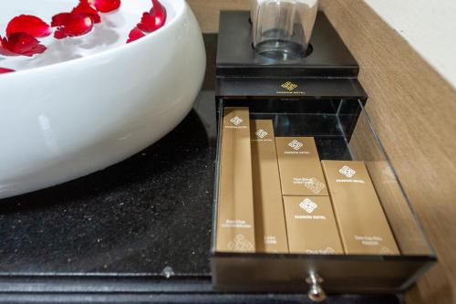 a table with a bowl of popcorn and a box at Sapa Passion Hotel & Spa in Sa Pa