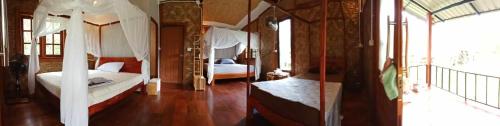 Postel nebo postele na pokoji v ubytování Mook Bamboo Bungalows