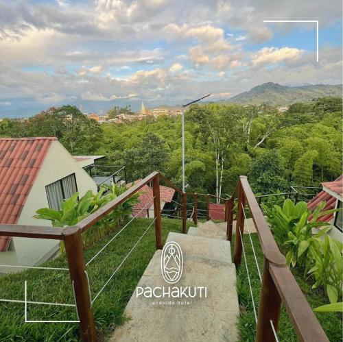 a set of stairs leading up to a house with a view at Pachakuti Eco-vida Hotel in Caicedonia
