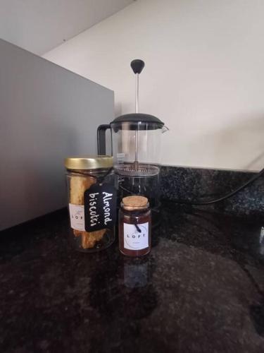 a counter top with two jars and a blender at The Loft in Mtunzini