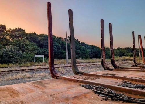an old train track with the gates of a train station at The Loft in Mtunzini