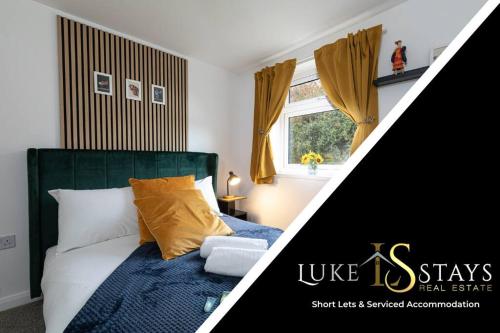 a bedroom with a bed with blue sheets and yellow pillows at Luke Stays- Newton Hall Cottage in Durham