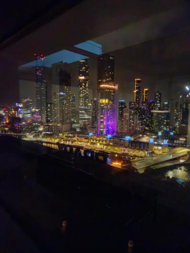 a view of a city at night with at Melbourne Star in Melbourne