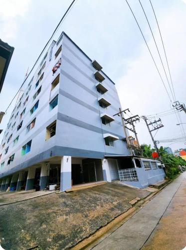 a white building with balconies on the side of it at 803-STP Homely room Free Wi-Fi and Near BTS line in Bangkok