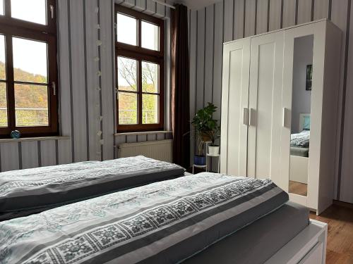 Postel nebo postele na pokoji v ubytování Ferienwohnung Auszeit im Südharz